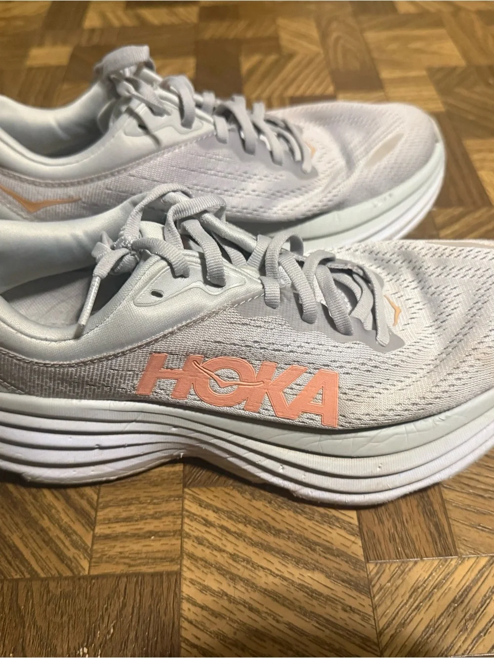 Hoka Women's Light Gray Running Shoes with Peach Logo Accent